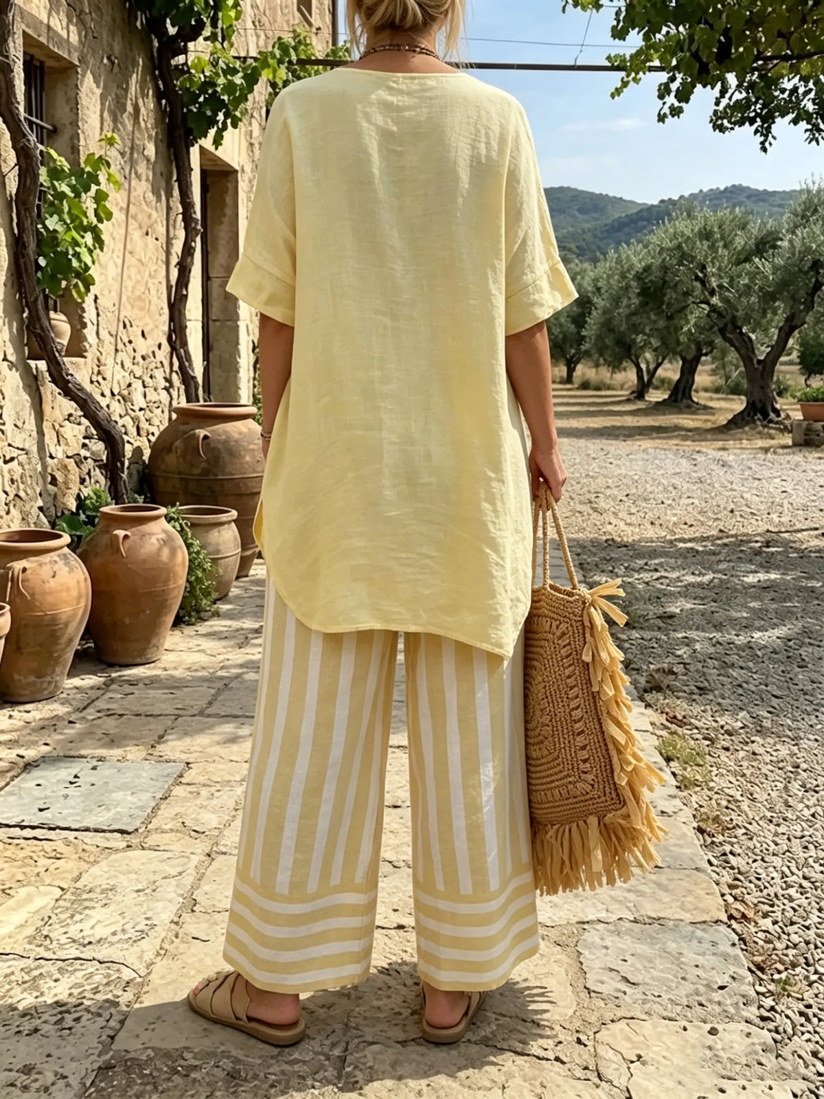 Women's Yellow Asymmetrical Top and Striped Pants Set