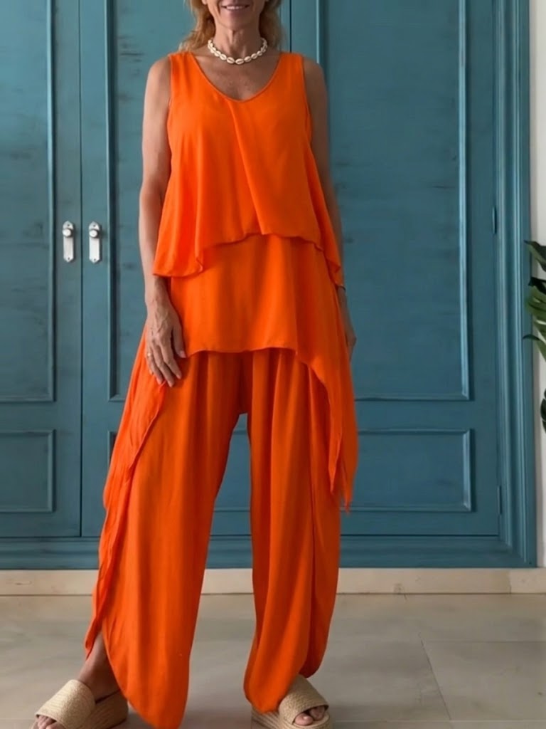 Casual Two-piece Set Featuring A Sleeveless Drop-shoulder Top And Trousers.